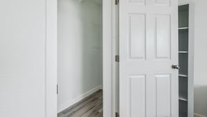 A white door with a built-in shelving unit on the right side. - Fresh 1BR/1BA in Downtown Tacoma - 2 (Tacoma)