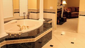 A spacious bathroom with a large bathtub, marble countertops, and a modern design. - The Grand Estate in Freeport PA just NE of Pittsburgh Pa Private Pool (Freeport)