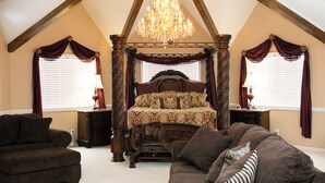 A bedroom with a four-poster bed, a chandelier, and a large window with curtains. - The Grand Estate in Freeport PA just NE of Pittsburgh Pa Private Pool (Freeport)