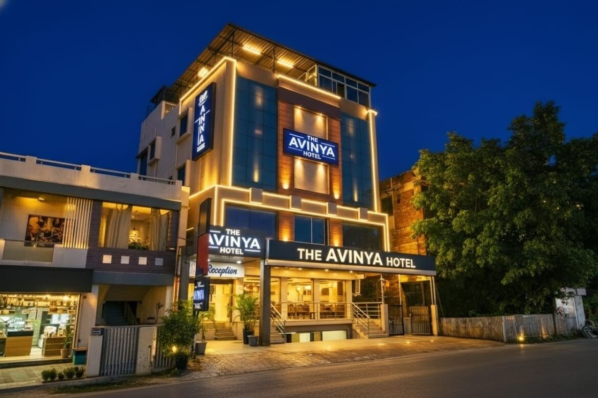 A hotel with a modern design, featuring a reception area and multiple floors.