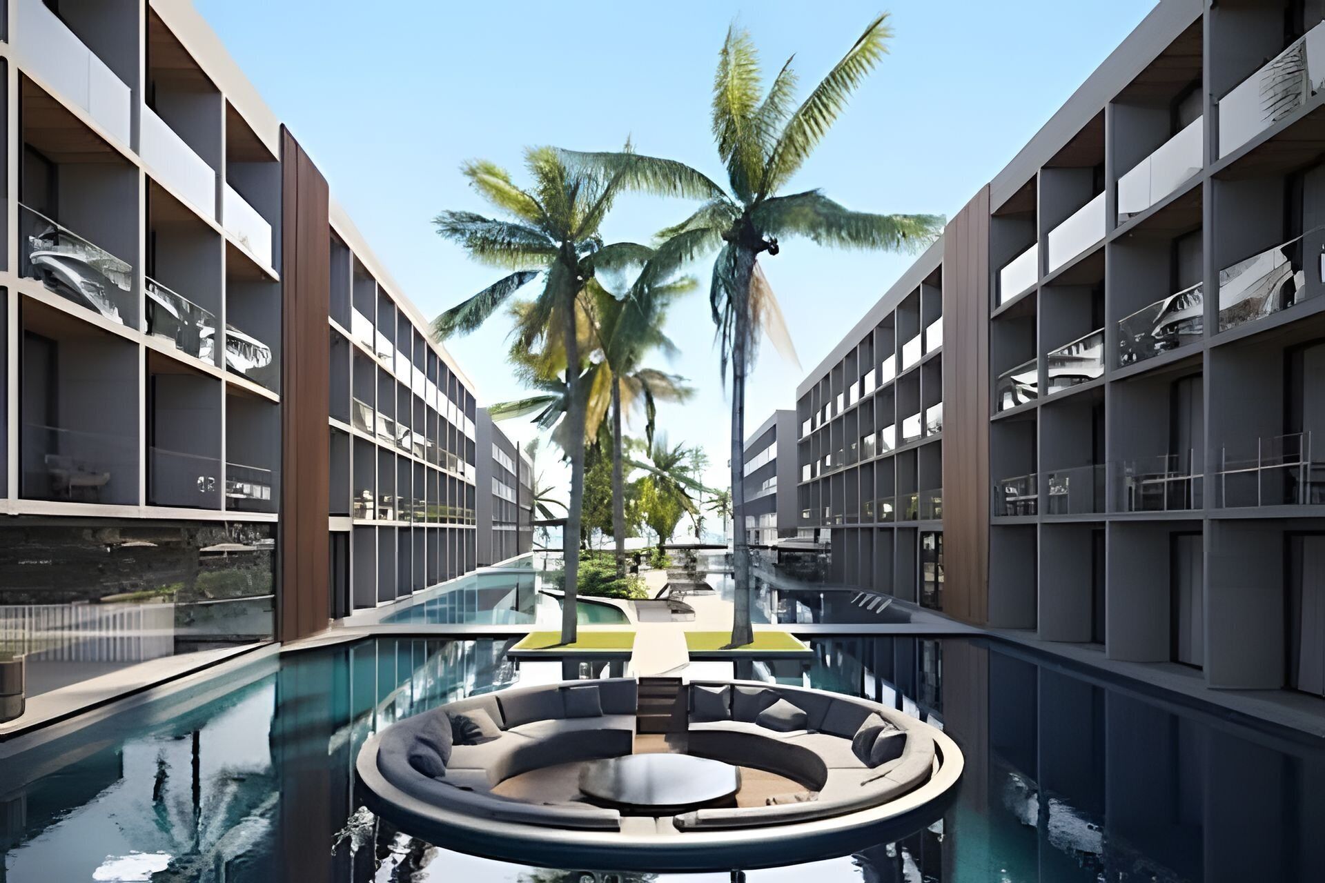 A modern hotel with a central pool, surrounded by balconies and palm trees.