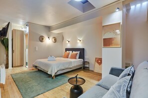 Apartment | Laptop workspace, iron/ironing board, bed sheets