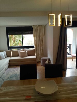 Appartement Familial, vue jardin | Coin séjour