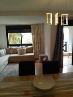 Family Apartment, Garden View | Living area | Fireplace