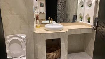 Family Apartment, Balcony, Garden View | Bathroom | Shower, hair dryer, towels, soap
