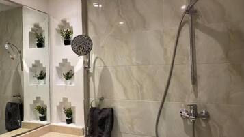 Family Apartment, Balcony, Garden View | Bathroom | Shower, hair dryer, towels, soap