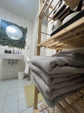 Shower, hair dryer, towels, soap