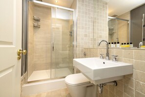 Shower, hair dryer, towels, soap