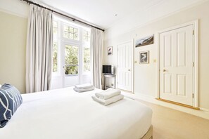 1 bedroom, desk, iron/ironing board, travel crib