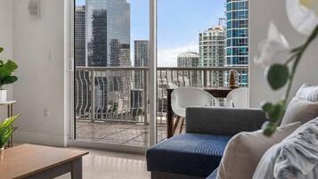 Luxury Apartment, Balcony, City View | Living area | 40-inch LED TV with cable channels
