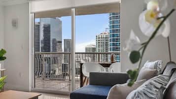 Luxury Apartment, Balcony, City View | Living area | 40-inch LED TV with cable channels