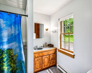 Shower, hair dryer, towels, shampoo