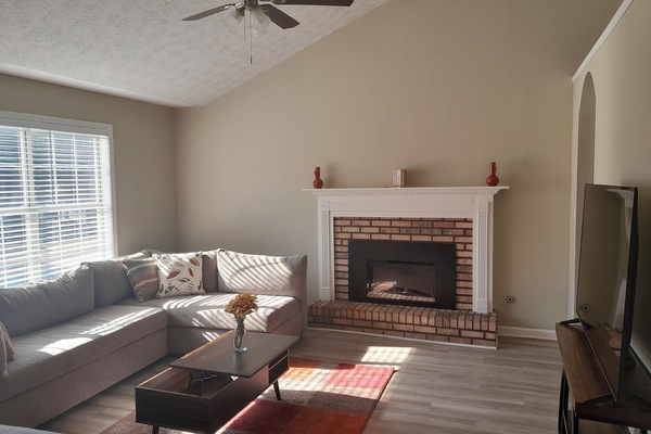 Living Room with sectional, Lounge chair, Fireplace and 55in smart TV
