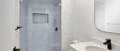Shower, hair dryer, towels, soap