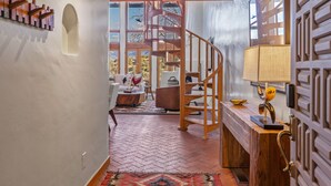 A wooden staircase leading to a loft area with a view of the outdoors. - Casa Serenata - Gated Pueblo Retreat Near Opera, Views + Office - Monthly (Santa Fe)