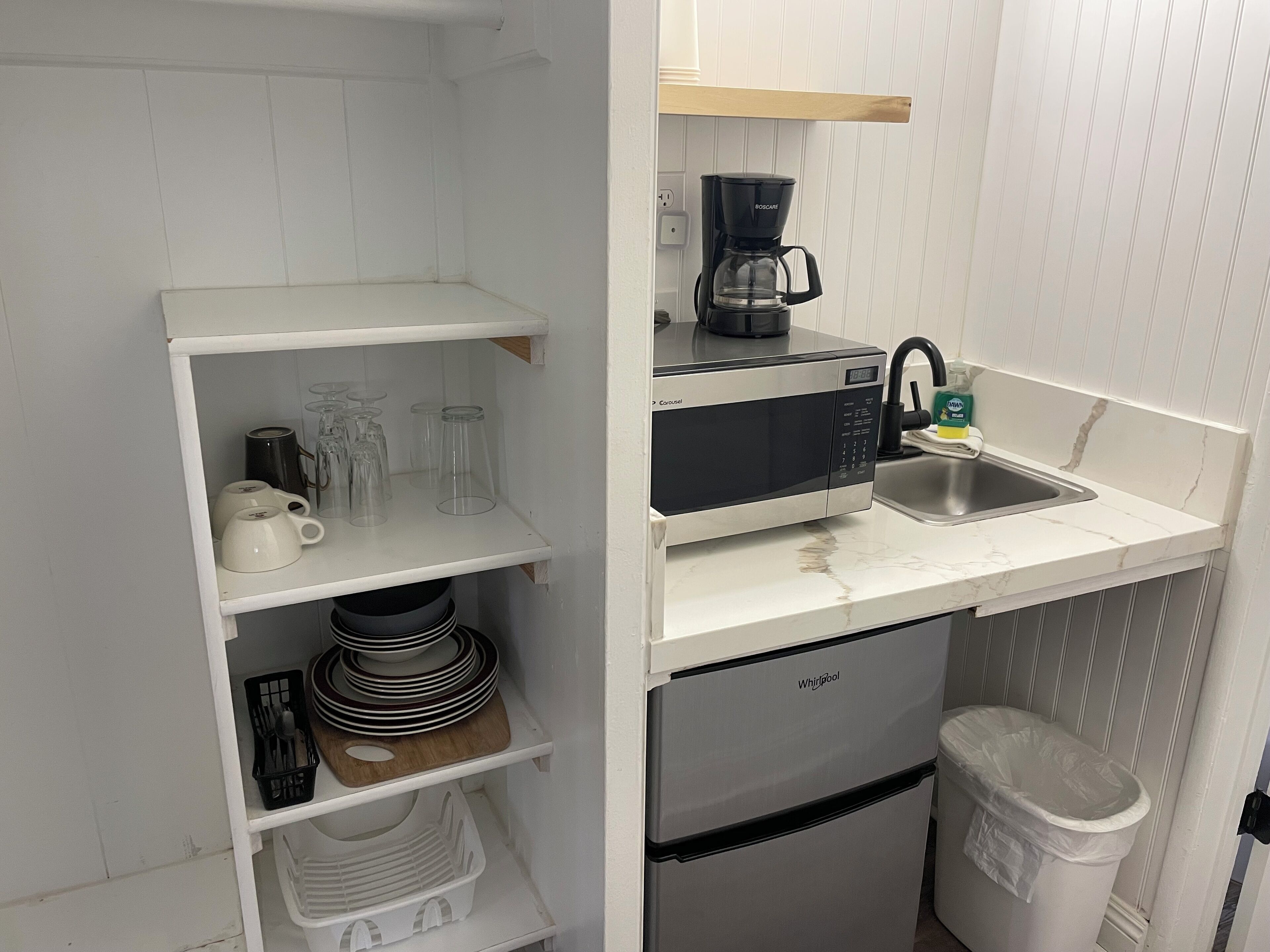 Mini-fridge, microwave, coffee/tea maker, cookware/dishes/utensils