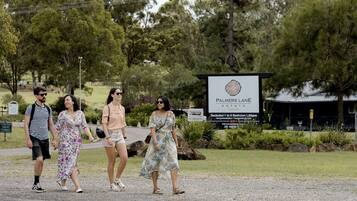 A sign for Palmers Lane Estate with a description of 1-6 bedroom lodges and corporate events.