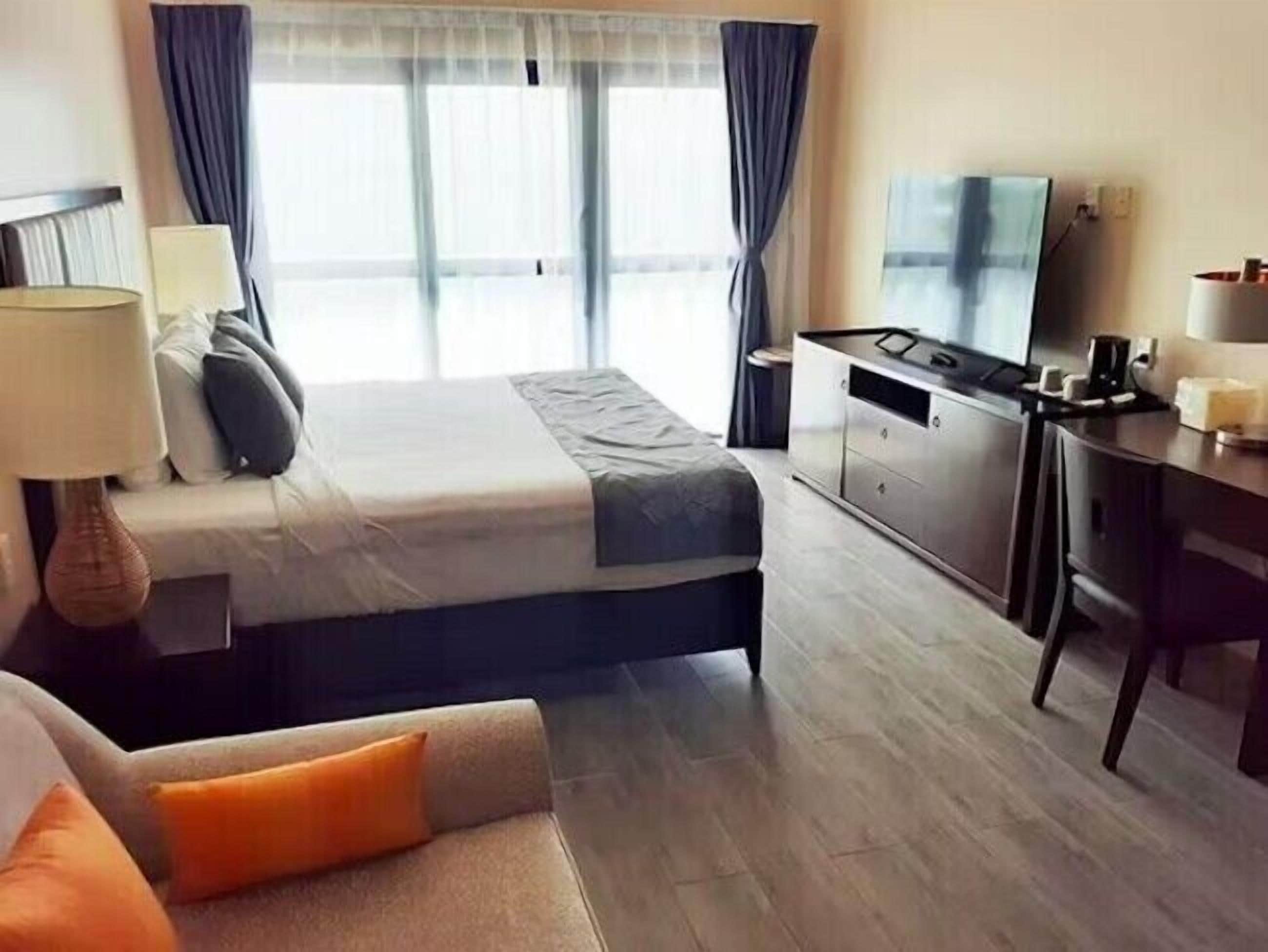 Superior Room, Ocean View | Desk, laptop workspace, blackout drapes, iron/ironing board