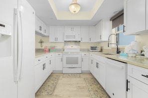 Fridge, microwave, oven, stovetop - Casa Marina 423: Canal-View Condo w/ Pool & Beach (Fort Myers Beach)