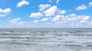 A beach with waves and a clear sky. - Sea Gull #503L: Beachfront 2 Bedroom 2 Bathroom With Spectacular Views and 24 Hour Management (Port Aransas)