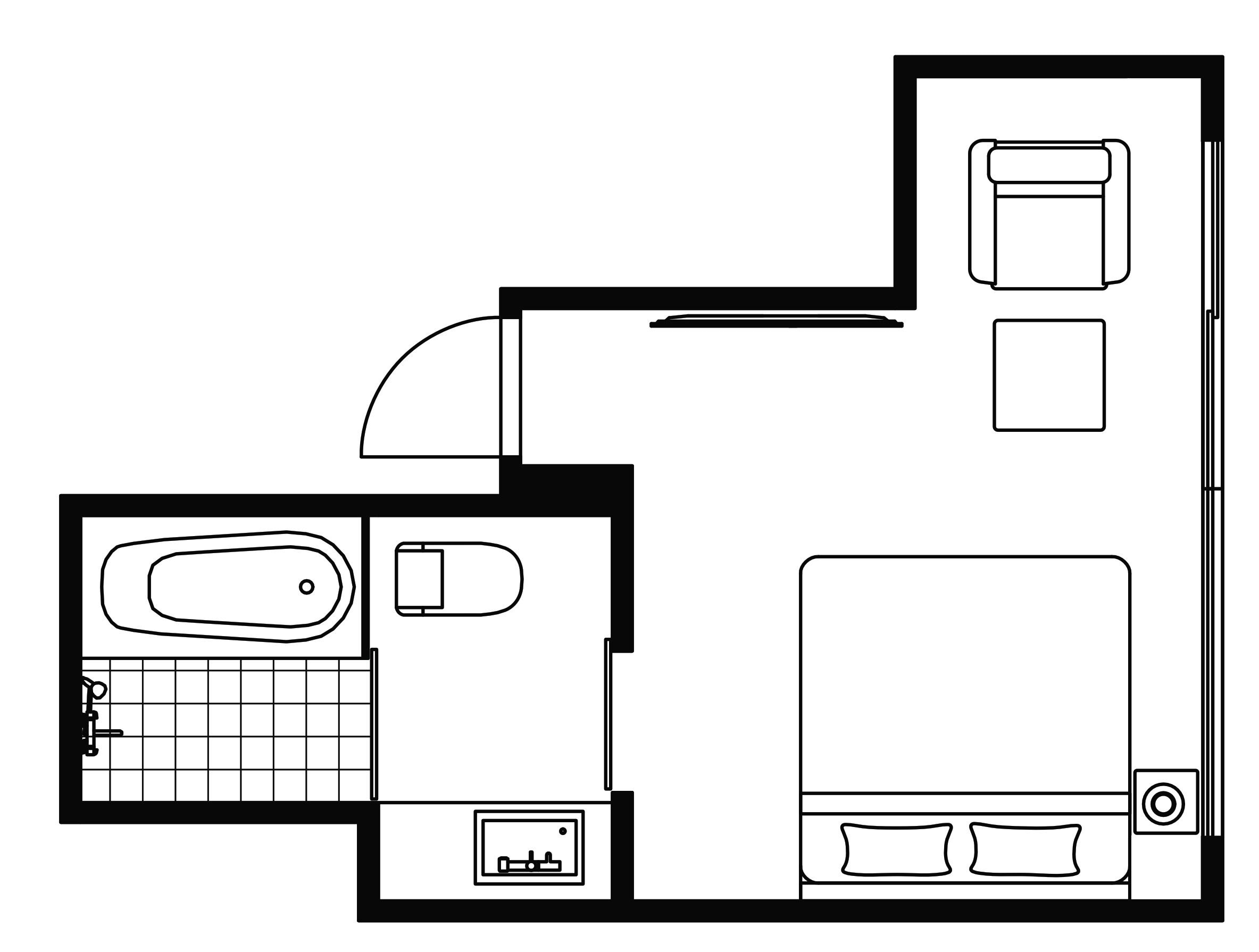 A floor plan of a hotel room with a bathroom, a bed, a desk, and a small seating area.