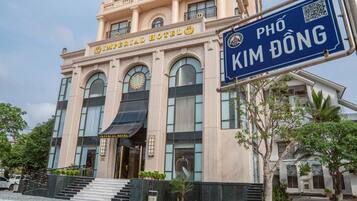 The exterior of the Imperial Hotel with a sign for Phò Kim Đoòng.