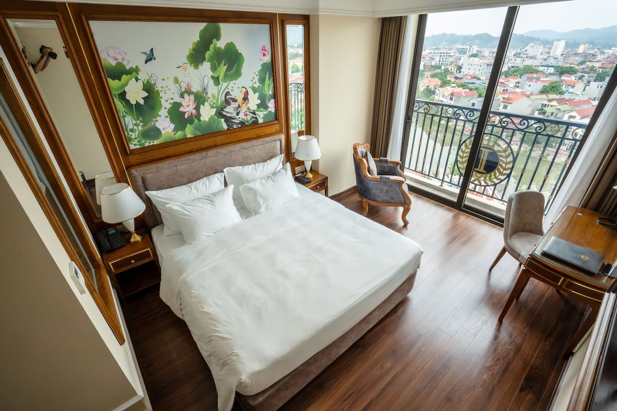 Deluxe Room, Balcony, Lake View | Minibar, in-room safe, desk, laptop workspace