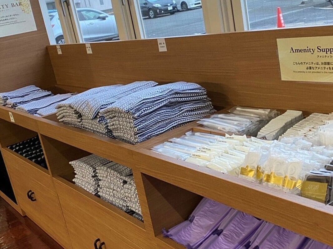 A display of neatly folded towels and linens in a hotel room.