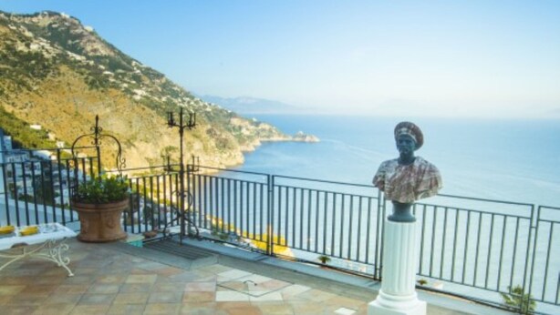 A swimming pool with a view of the sea, a statue, and a terrace with potted plants. - Le Anfore exclusive property with private pool (Praiano)