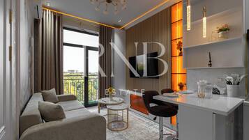 Condo Confort, balcón, vista a la ciudad | Área de sala de estar