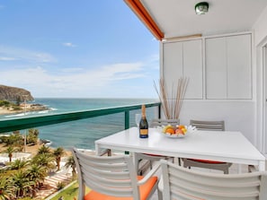 Enjoy a romantic dinner for two on this balcony overlooking the ocean and rocky coastline.