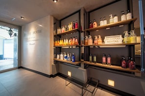 A hotel interior with a 'Manor House' sign, shelves of toiletries, and a 'Shampoo Rental' sign. - MANORHOUSE - Adult Only (Warabi)