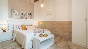 A bedroom with a bed, bedside tables, a bedside lamp, a decorative wall piece, a hanging light, and a wardrobe. - Can Potdir - Villa With Private Pool In Ariany (Ariany, Illes Balears)
