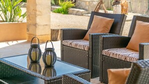 Wicker furniture with cushions, a glass table, and two lanterns. - 3 C'an Boto - Villa With Private Pool In Manacor (Manacor, Illes Balears)