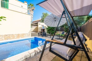 A swimming pool with lounge chairs and a pergola. - Calamari - Villa With Private Pool In Felanitx (, Illes Balears)