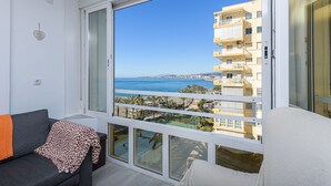 A balcony with a view of the sea and a building across the water. - Algarrobo Costa - Apartment In Algarrobo-costa (Algarrobo Costa, Málaga)