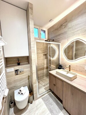 Shower, hair dryer, towels, soap