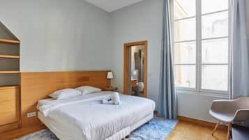 Apartment | Laptop workspace, iron/ironing board, bed sheets