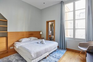 Apartment | Laptop workspace, iron/ironing board, bed sheets