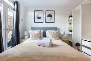 1 bedroom, desk, iron/ironing board, travel crib