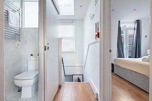 1 bedroom, desk, iron/ironing board, travel crib