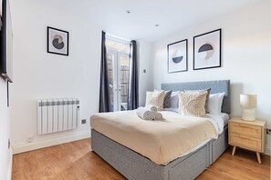 1 bedroom, desk, iron/ironing board, travel crib