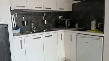 Fridge, microwave, cookware/dishes/utensils