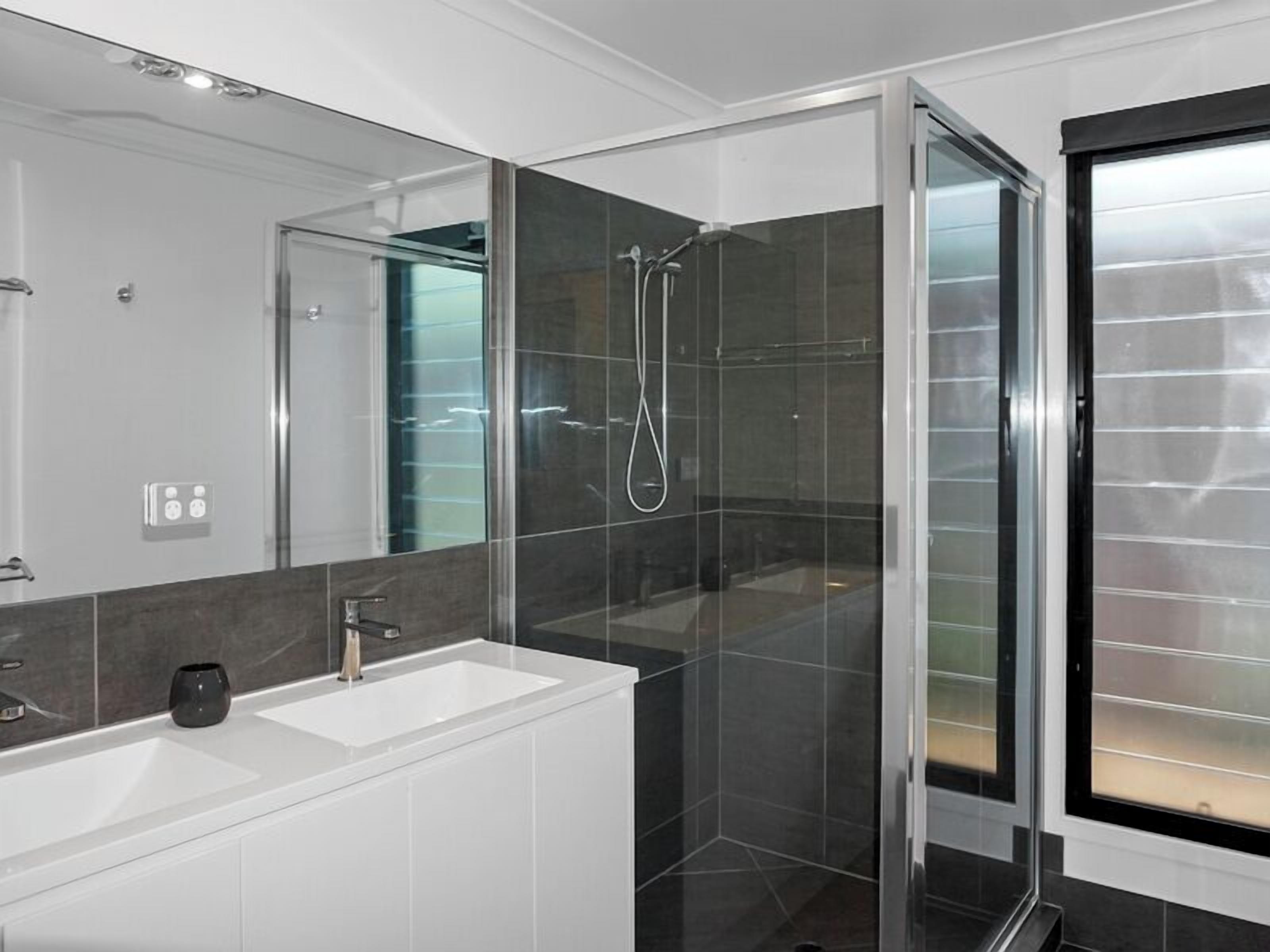 Shower, hair dryer, soap, toilet paper
