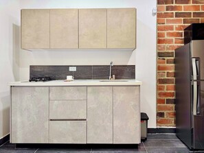 Fridge, microwave, stovetop, coffee/tea maker