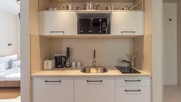 Standard Studio (Nemes Apartment The Petite) | Private kitchen | Fridge, microwave, oven, stovetop