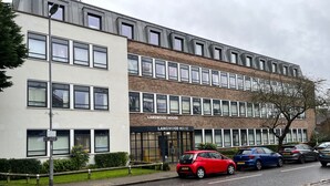 A multi-story building with a sign reading "Langwood House." - 2br-modern-fullkitchen-25mincentrallondon-parking (Rickmansworth)