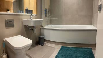 Apartment | Bathroom | Combined shower/tub, deep soaking tub, towels