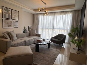 Basic Apartment, 3 Bedrooms | Living area - Mynt Stay zed west Residence (Sheikh Zayed City)