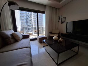 Apartamento superior, 2 quartos | Área de estar